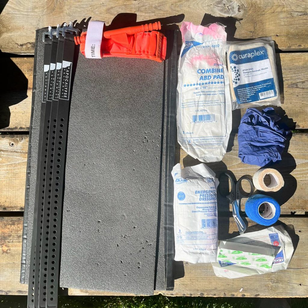 Trauma kit: splint materials, tourniquet, bandage supplies, mini trauma shears