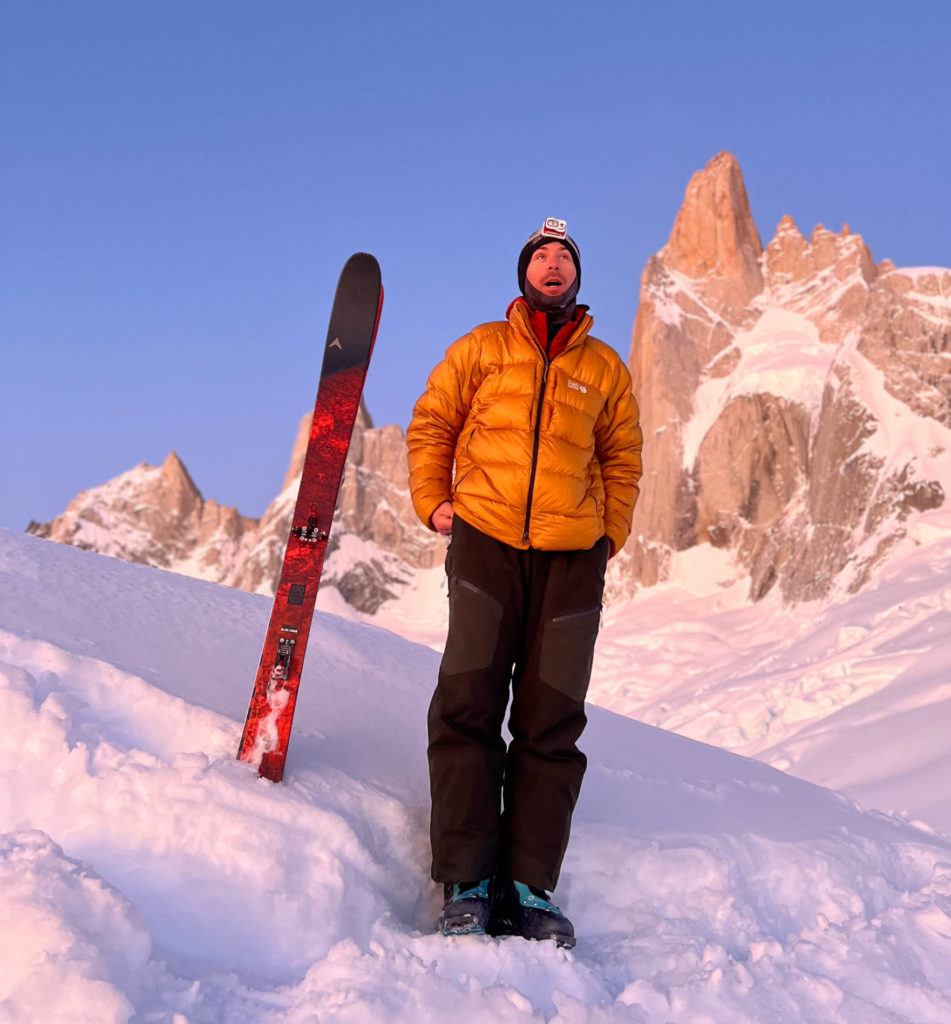 The glow is real: Vivian Bruchez with Aguja Poincenot and the two ski lines in the background. Photo courtesy Vivian Bruchez