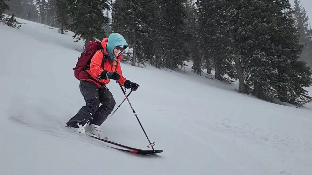 Brittany sliding along in 2022 as she find some early season snow stashes in the Utah backcountry.