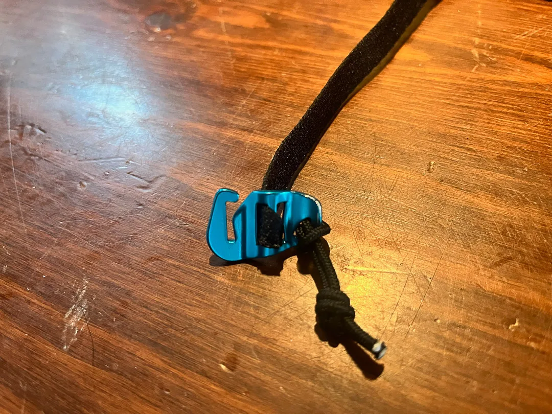 Harfang aluminum hook to secure crampon strap.