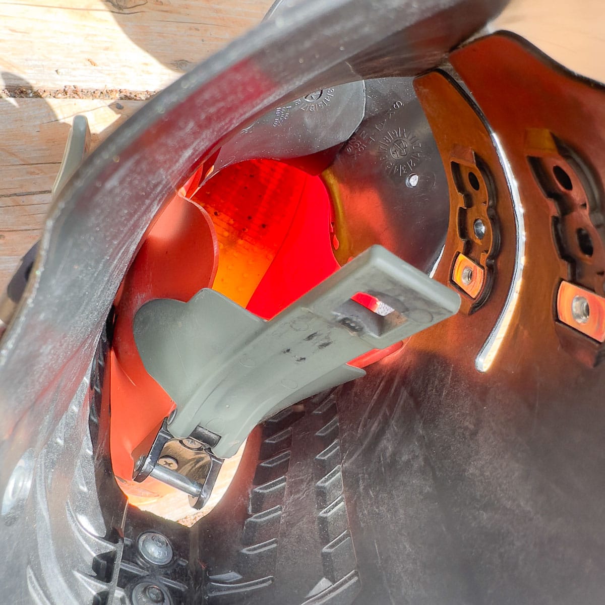 The green plastic shell ski/hike mechanism (center) was replaced on one THR associate’s boot this winter.
