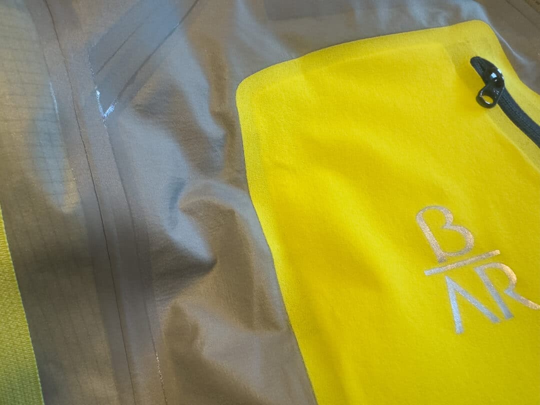 The Beta AR jacket interior shows the inner pocket and the high-quality seam construction.