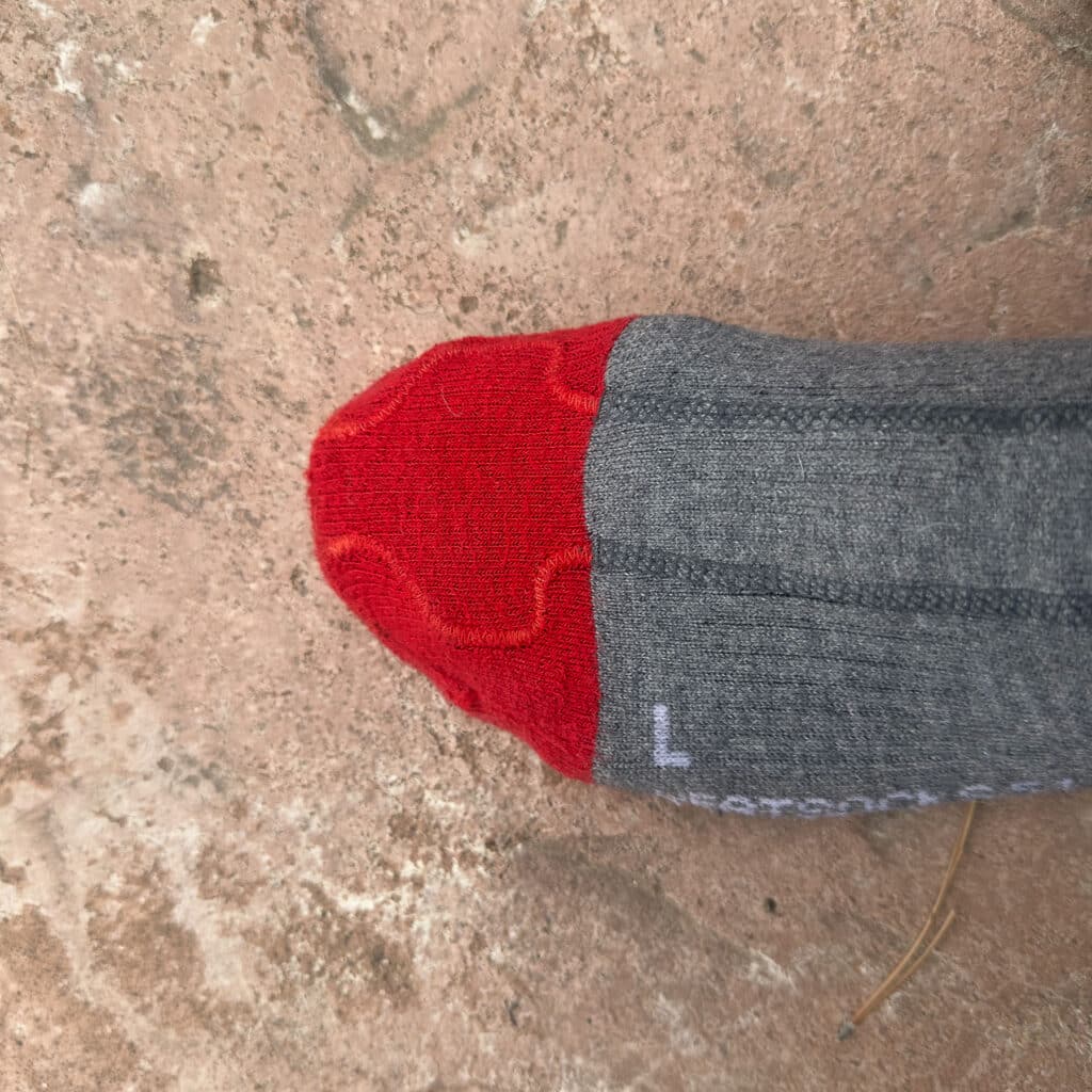 The heating elements, shown here with the raised stitches, send heat to the toe zone.