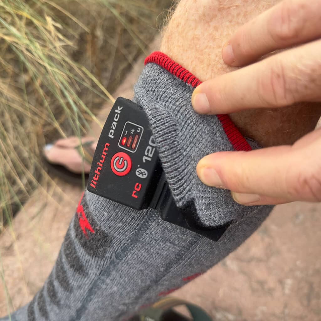 Fold the cuff over to over the battery.