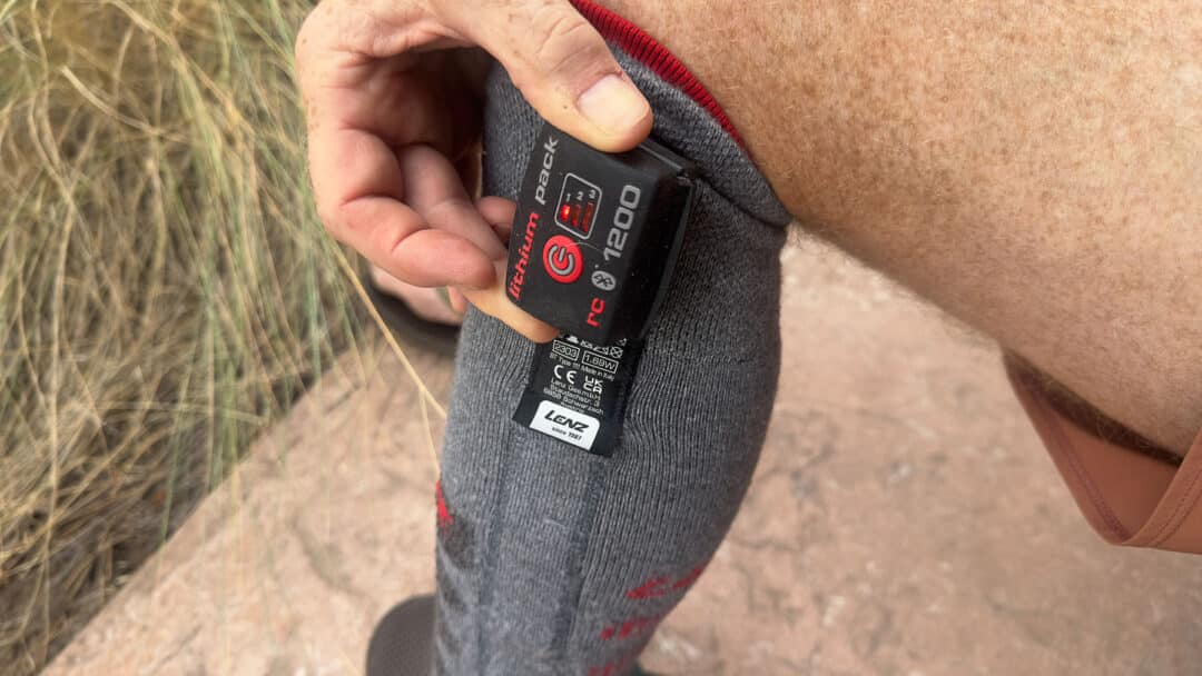 The battery is turned on and heating the sock at level 1 (the lowest setting).