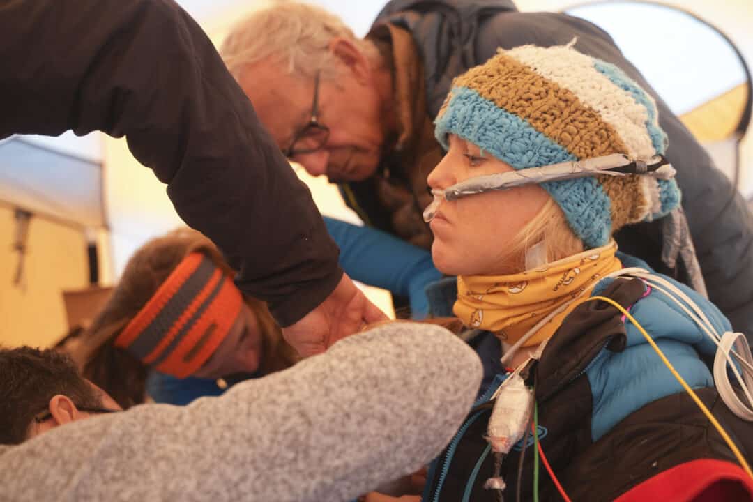 A participant in the clinical trial is prepped to be buried in the snow. Photo: Safeback Clinical Trial 