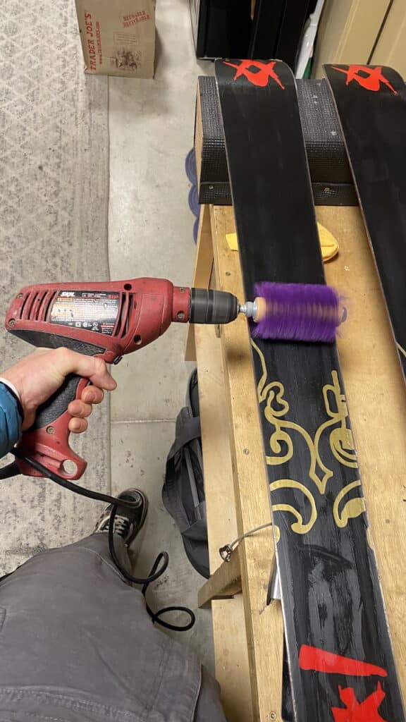 Rotobrushing the ski wax.