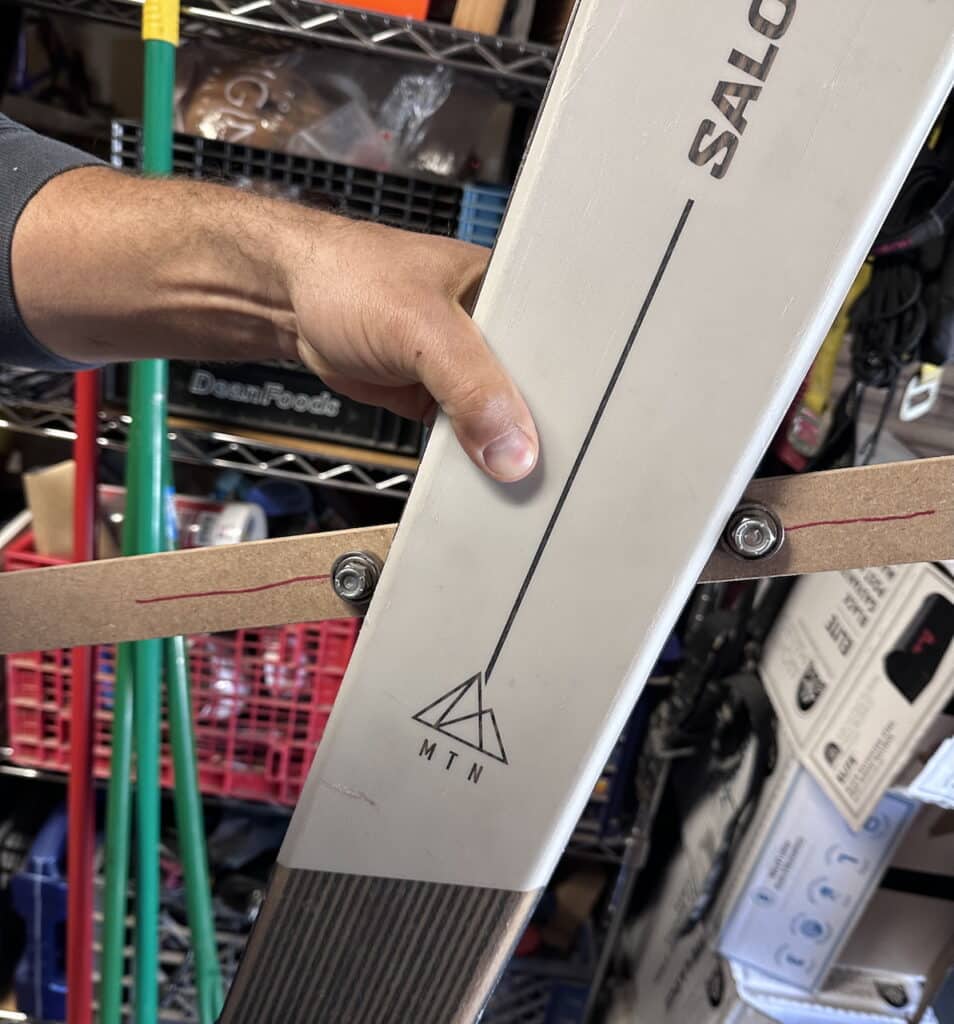 The backside of the jig. The nuts up against the ski's edges ensures an accurate center mark. However, this is for display, to show the jig’s underside and how it lays against the edges.