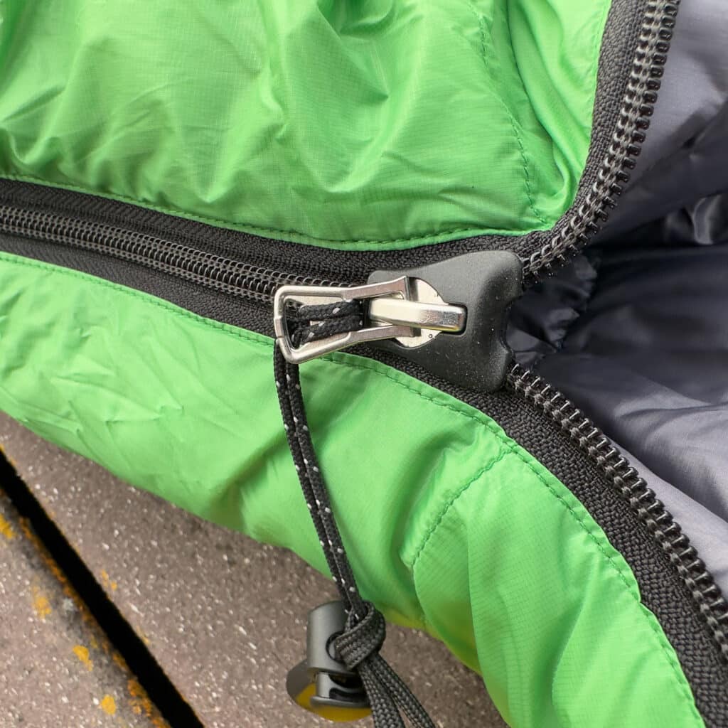 The plastic housing on the zipper pull helps with the no-snag attributes. 