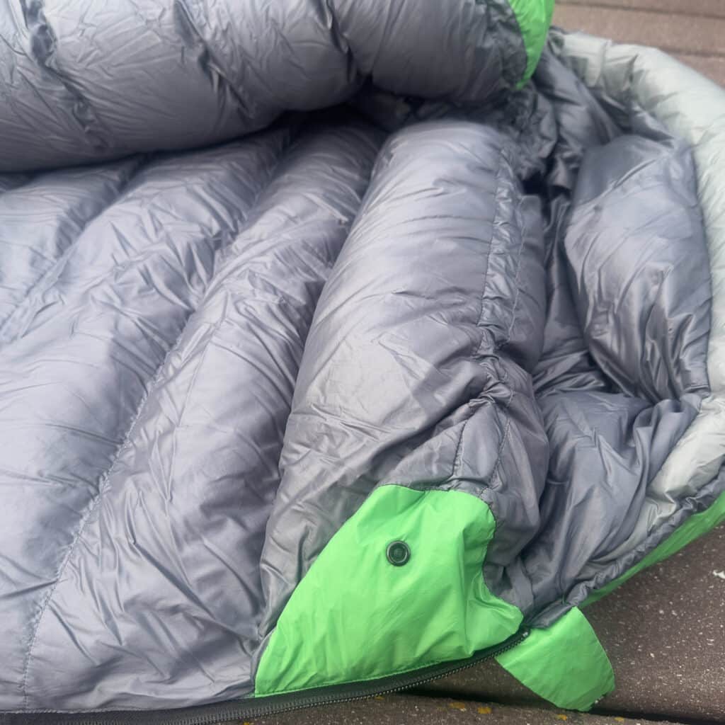 The draft collar is robust and is fitted with a snap closure and cinch cord to snug you up.