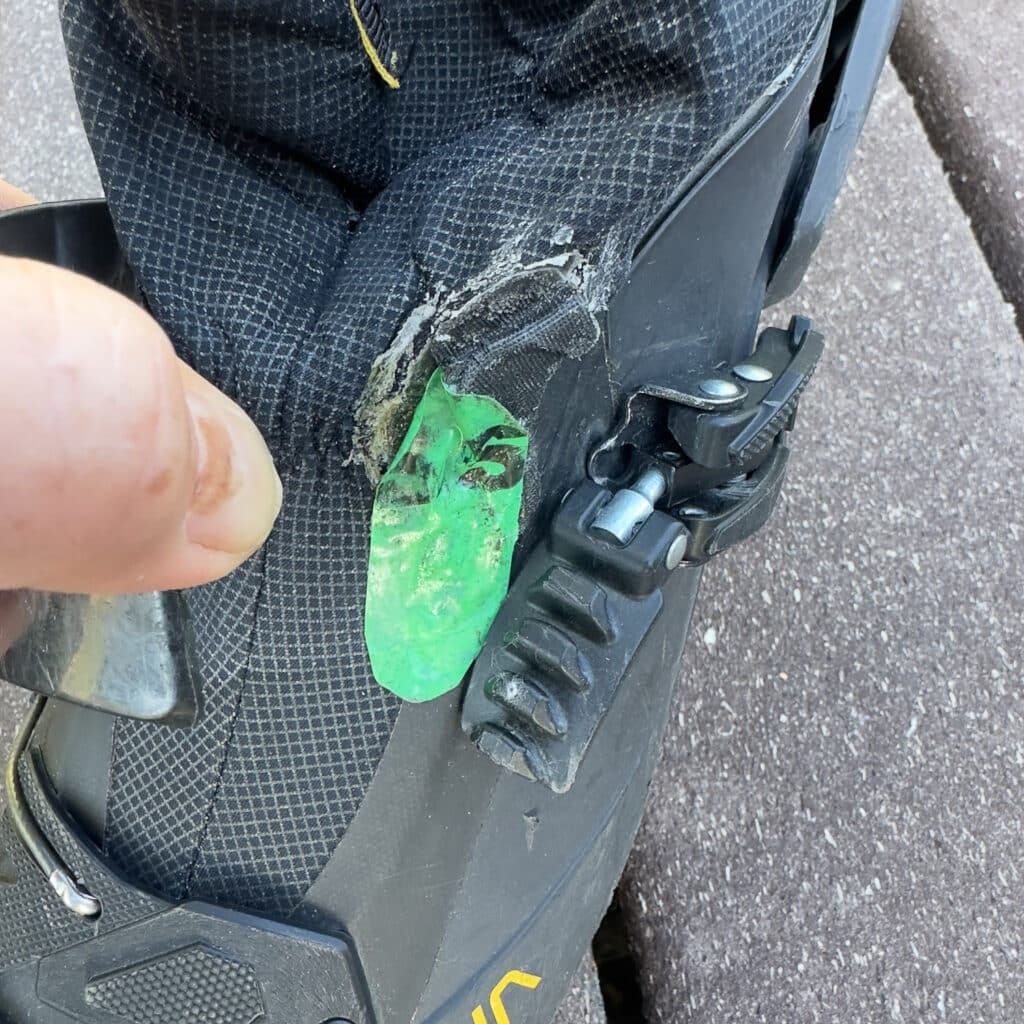 Shown here is the spot I have reinforced on the boot gaiter. My initial reinforcement, glued on last season, has been reinforced this season with a layer of burly green Rissan tape.