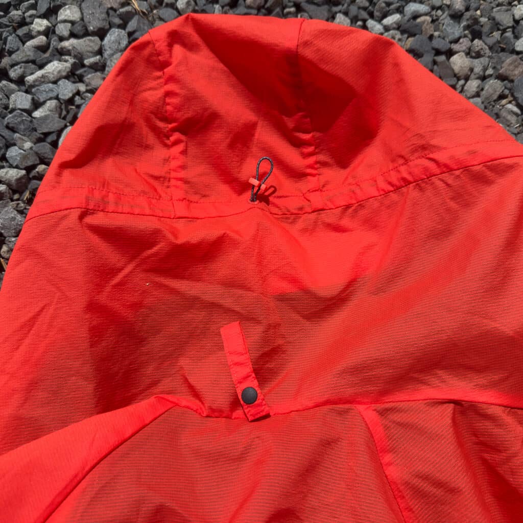 The hood, which fits under a helmet, has a cinch for snugging it down. Note the snap-closer at the hood's base; it's possible to roll the hood up and stow it for a more streamlined look.