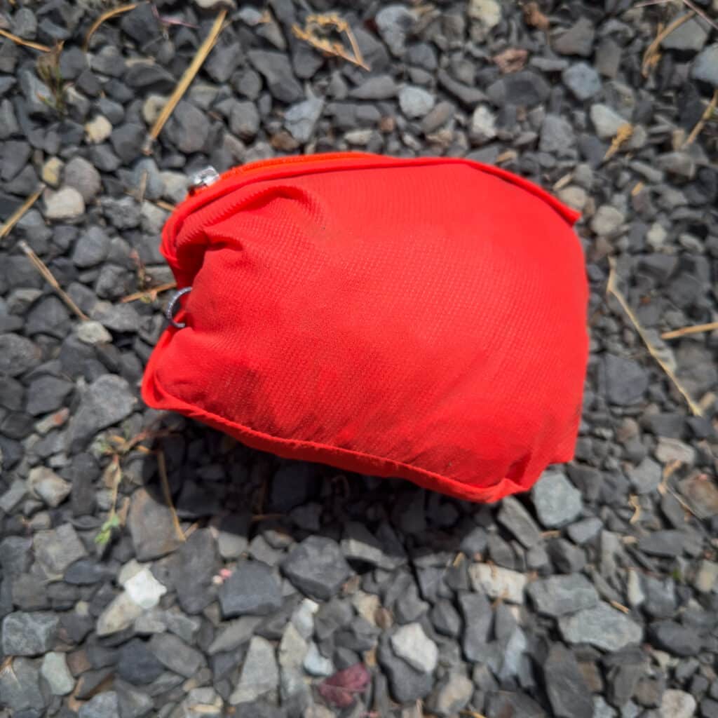 The Stellar Aerolight stuffs into its chest zipper pocket down to roughly fist size.