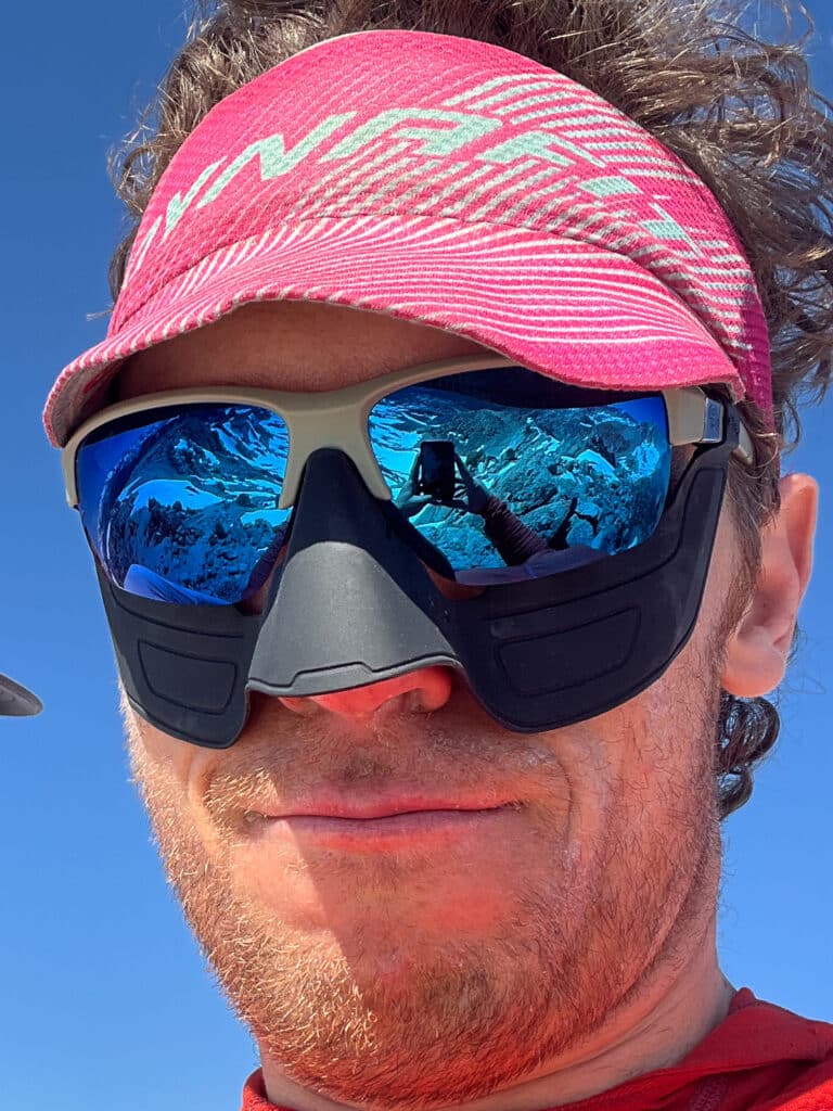 The full kit: nose guard, face mask, ... mountains.